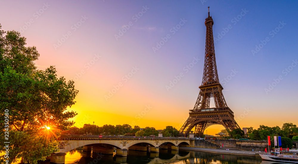 View of Eiffel Tower and river Seine at sunrise in Paris, France. Eiffel Tower is one of the most iconic landmarks of Paris